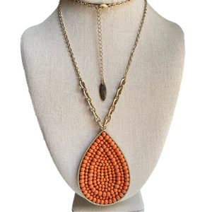 Plunder boho dark orange beaded teardrop pendant necklace on long goldtone chain